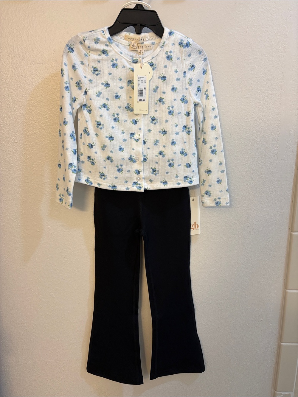 Copper Key White Top with Blue Floral Print & Black GB flare leggings.